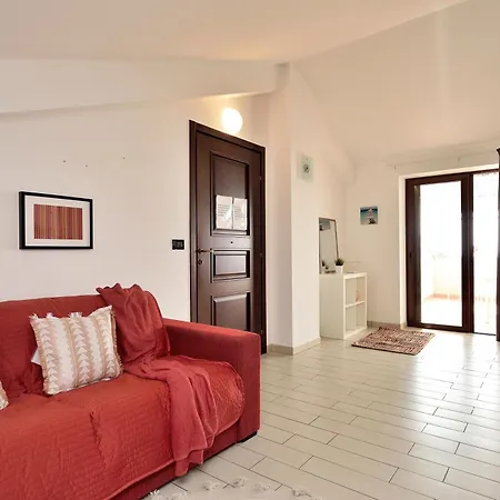 Апартаменты Attico Vista Mare E Piscina